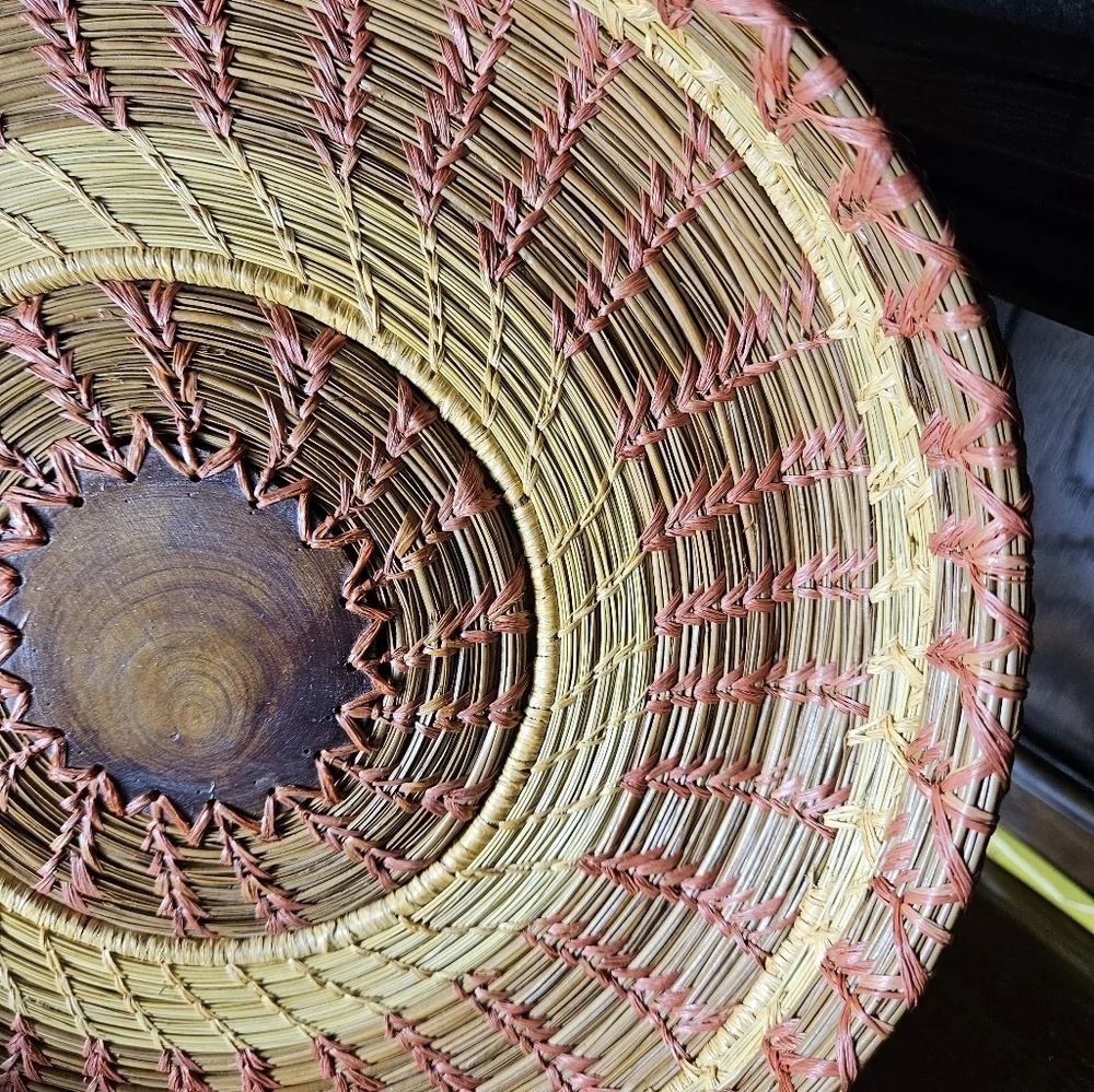 Primitive Handwoven 10 Inche Basket With A Wood Medallian In The Middle.